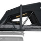 Black roof tent on a vehicle with a clear background