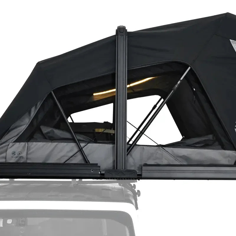 Black roof tent on a vehicle with a clear background