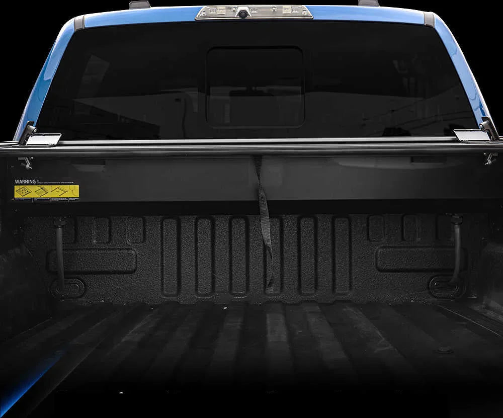 Back of a pickup truck with a black bed cover
