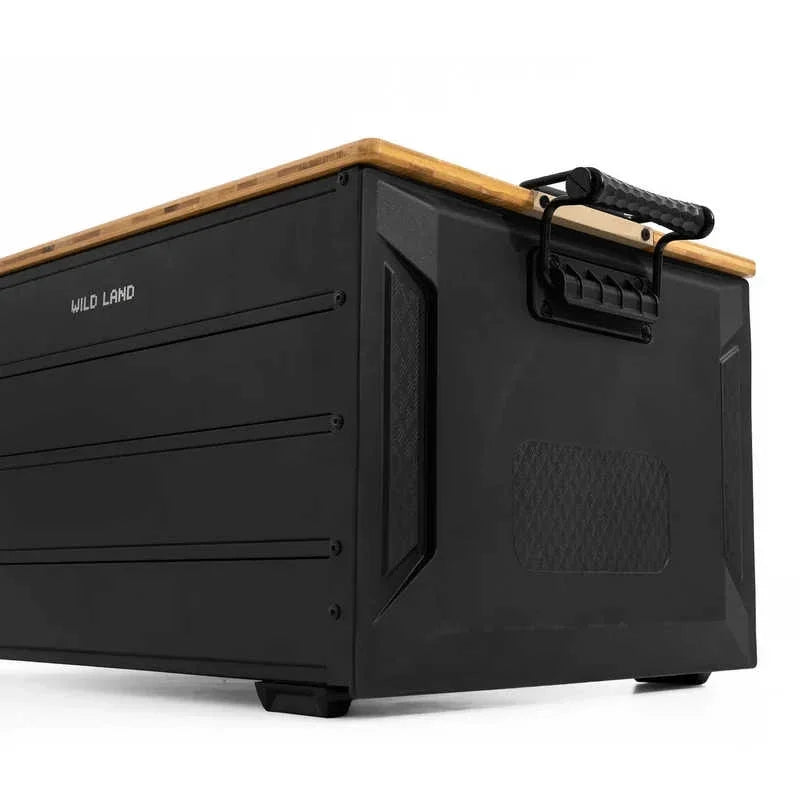 A black metal storage chest with a light wood top and black carrying handles, shown on a clean white background. The brand name 'MILD LAND' is printed on the side.