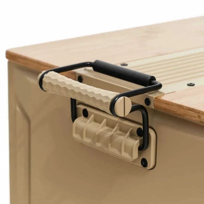 Close-up of a beige cooler or storage box with a wooden top, featuring a black metal handle frame and a cream-colored textured handle.