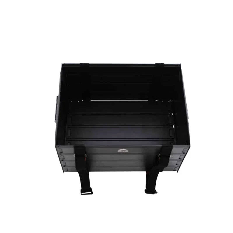 A black metal utility cargo bed with integrated side straps and a slatted bottom, shown from a top-down perspective on a white background.