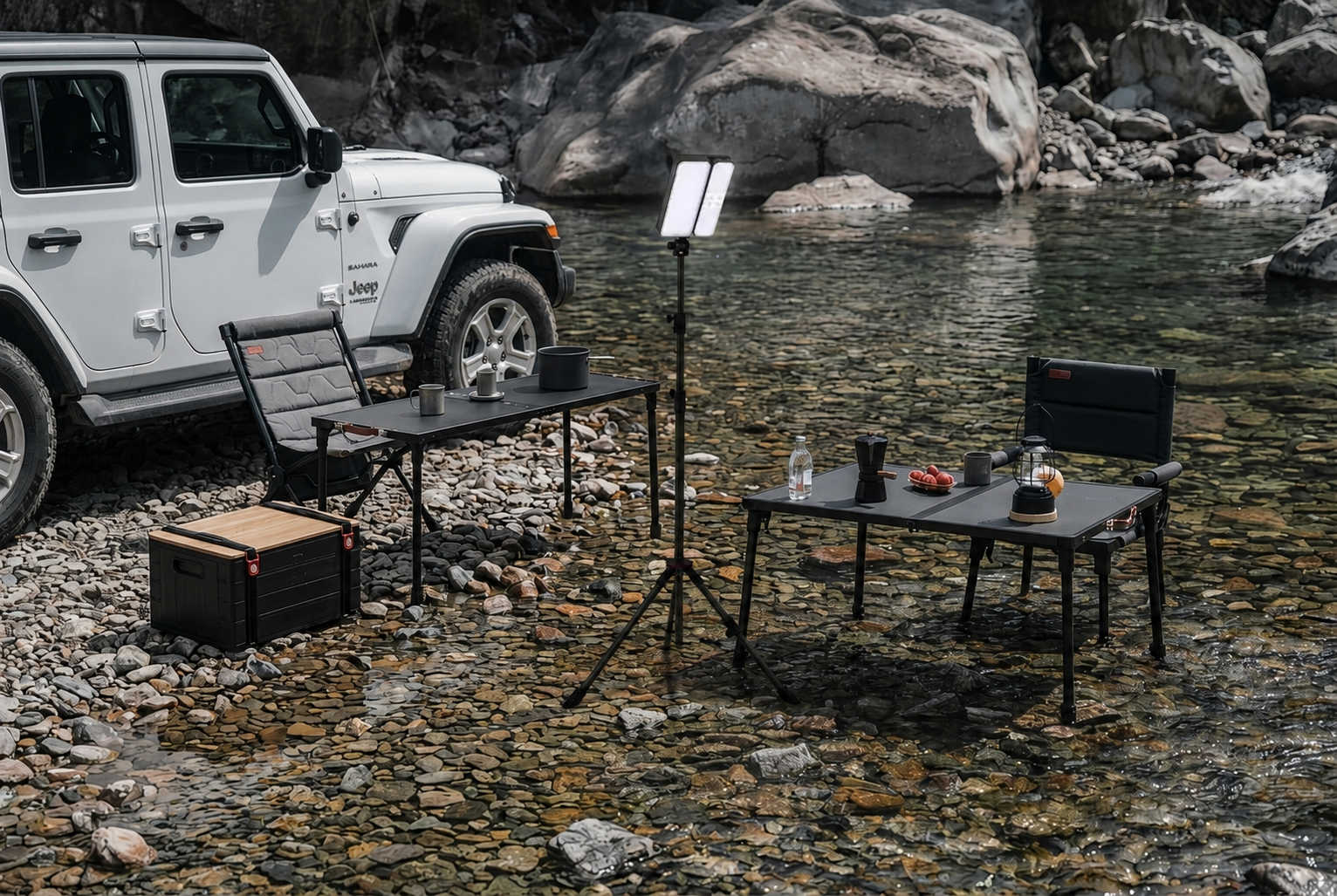Outdoor setup with tables, chairs, and a Jeep by a body of water.