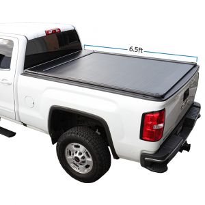 white 2023 Sierra 1500 with SyneticUSA's auto retractable truck bed cover