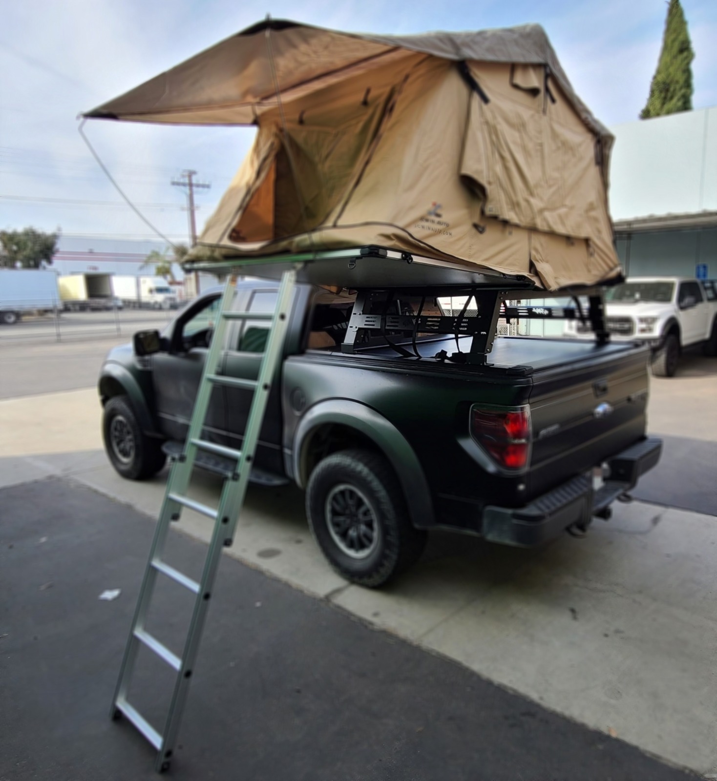 SyneticUSA's retractable cover with utility rack and tent